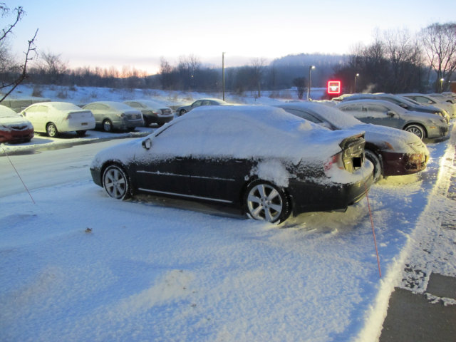 Subaru Legacy GT dusted with snow.