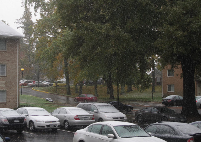 Snow falling in my apartment parking lot.  In October 2011.