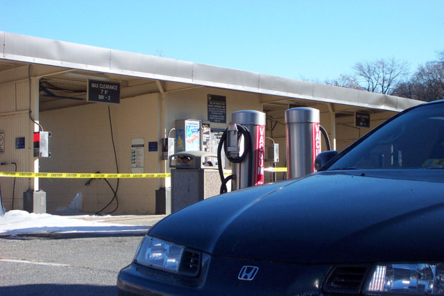 1995 Prelude parked in front of a pay-by-quarter car wash, blocked off with caution tape due to ice everywhere.