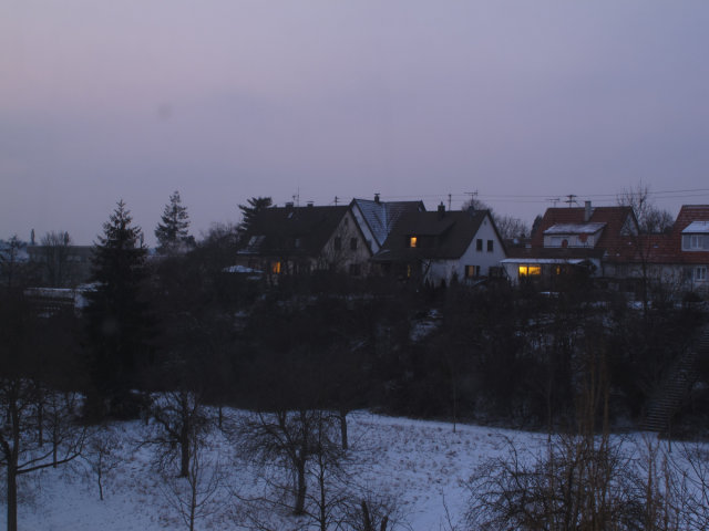 A home at twilight, in the snow, in Stuttgart, Germany