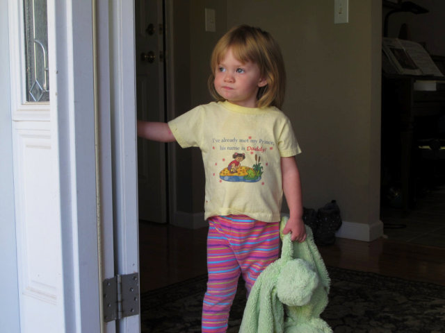 My niece, standing in a doorway.