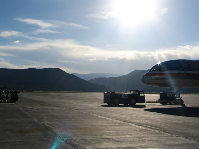 Picture of an airplane parked on a runway.