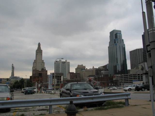 Kansas City downtown; a ragged looking gentleman getting into his car.