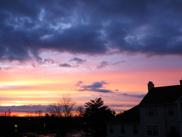 A sunrise, pink, blue, grey.