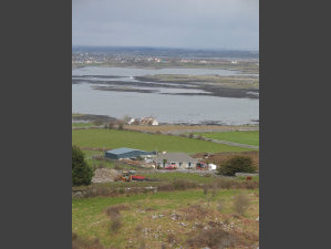 A small farm, in the middle of rocks.